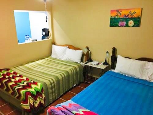 Bedroom at Bamboleo Inn in Belize