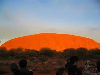 Uluru in Austalia glowing at sunrise