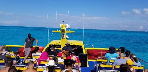 A musician playing aboard the Ultramar Ferry from Cancun to Isla Mujeres