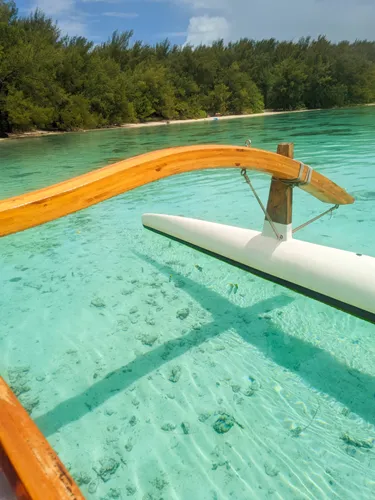 island and turquoise water seen from a boat on an island tour in Moorea in French Polynesia