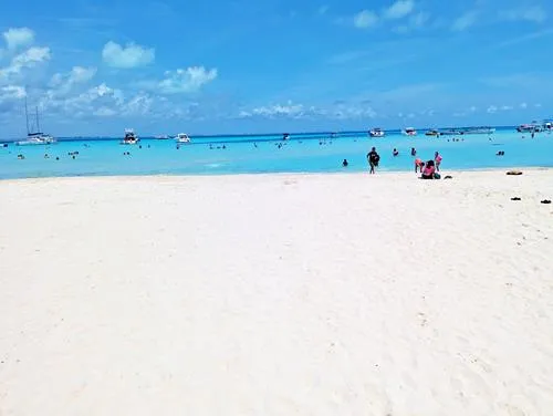 Playa Norte with white sand, turquoise water, beach umbrellas and loungers in Isla Mujeres