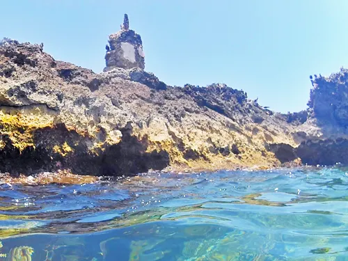 El Farito Lighthouse seen when snorkeling at El Farito Reef / Lighthouse Reef near Isla Mujeres