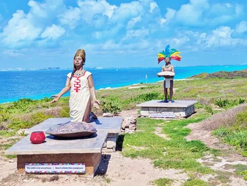 Two statues of Pre-Hispanic Mayan Offerers monument at Punta Sur in Isla Mujeres