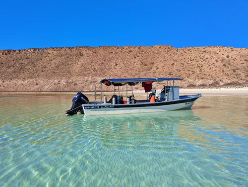 beach with boat on Espiritu-Santo Island in La Paz, Mexico