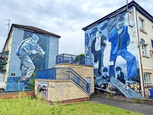 Operation Motorman/ The Summer Invasion and The Runner murals in Derry in Northern Ireland