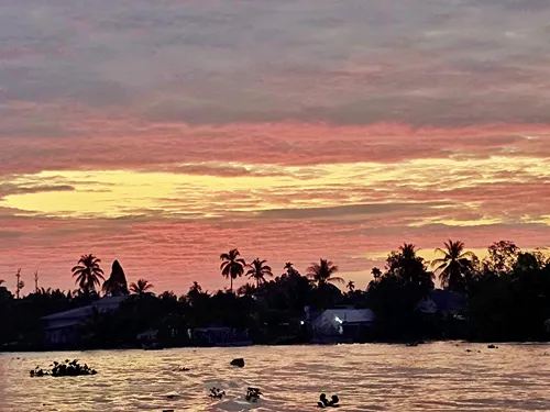 photo taken from a boat in the early morning at sunrise of the river in Can Tho in Vietnam