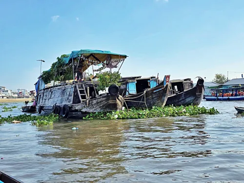 View of large ships at the  Cái Răng Floating Market near Can Tho in Vietnam