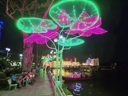 photo of the beautifully illuminated Can Tho Promenade at the waterfront in Can Tho, Vietnam