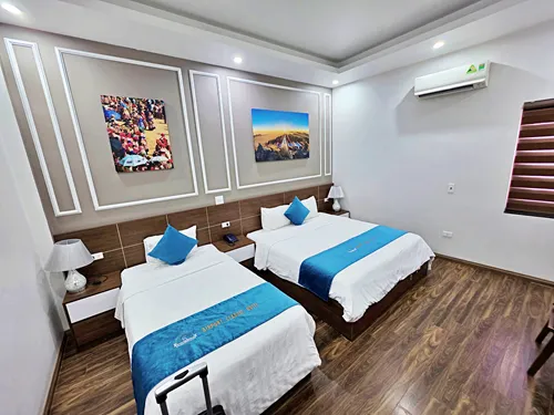 photo of the bedroom showing the beds at the Airport Classic Hotel & Travel in Hanoi in Vietnam