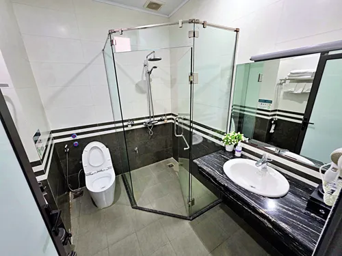 photo of the bathroom showing the beds at the Airport Classic Hotel & Travel in Hanoi in Vietnam