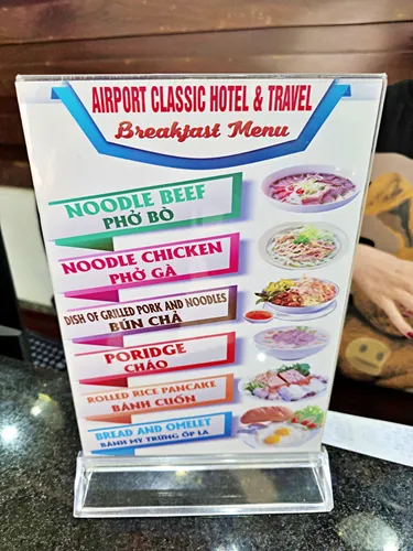 photo of the menu at the Airport Classic Hotel & Travel in Vietnam showing the different meal choices for breakfast