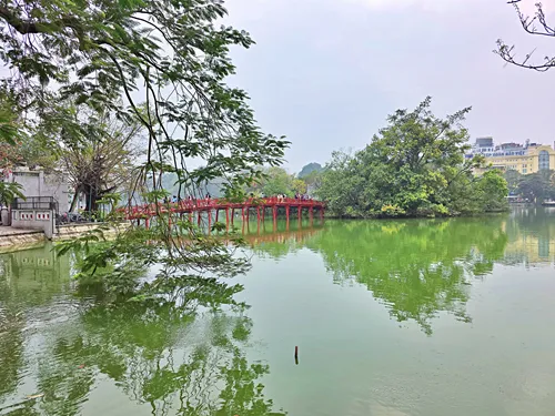 photo of the red bridge to Ngoc Son Temple in Hoan Kiem Lake in Hanoi in Vietnam