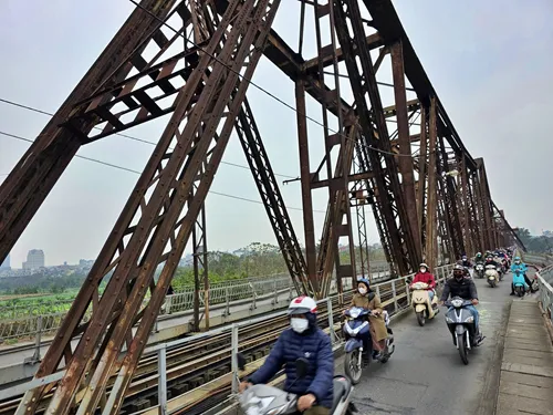 motorcycles on Long Bien Bridge in Hanoi in Vietnam