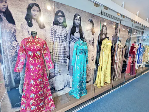 Photo of a traditional Vietnamese dress exhibition at Bitexco Financial Tower Saigon Skydeck over Ho Chi Minh City in Vietnam
