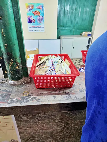 Photo of the basket with the post cards and letters that people send in the Ho Chi Minh Central Post Office in Saigon in Vietnam