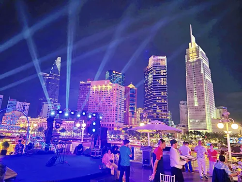 illuminated skyline in ho chin minh city during a river cruise in Vietnam