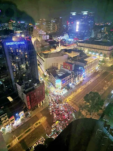 view from a room at the Fusion Original Saigon Centre in Ho Chi Minh City in Vietnam at night on the traffic in the city