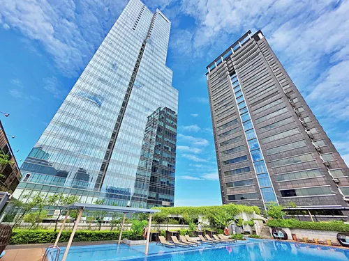 pool at the Fusion Original Saigon Centre in Ho Chi Minh City in Vietnam with shyscrapers in the background