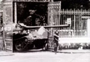 Historic photo of Tank 843 crashing through the front gate of the presidential headquarters for South Vietnam until 1975, now: Reunification Palace in Ho Chi Minh City in Vietnam
