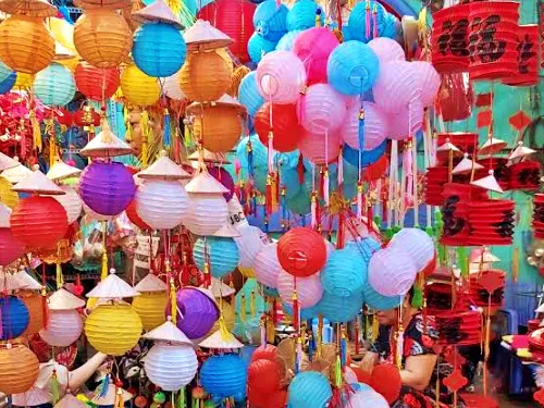 photo of many colorful lanterns at night at Luong Nhu Hoc Lantern Street in Ho CHi Minh City in Vietnam