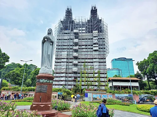 Saigon Cathedral of Notre Dame in Ho Chin Minh City, Vietnam, as seen from the outside with scaffolding at the front entrance