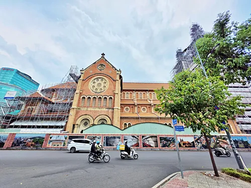 Saigon Cathedral of Notre Dame in Ho Chin Minh City, Vietnam, as seen from a street on the side