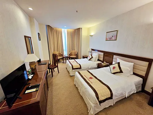 photo of a bedroom at the Tan Son Nhat Hotel in Ho Chi Minh City in Vietnam
