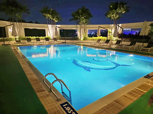 photo of the illuminated pool at night at the Tan Son Nhat Hotel in Ho Chi Minh City in Vietnam
