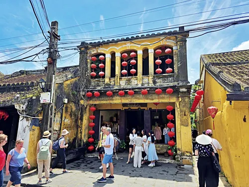 photo of red Lanterns at a yellow house in Hoi An during the Hoi An Lantern Festival in Vietnam