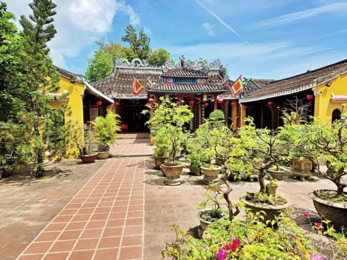 internal buildings and a garden within Cam Pho Communal House Hoi An in Vietnam