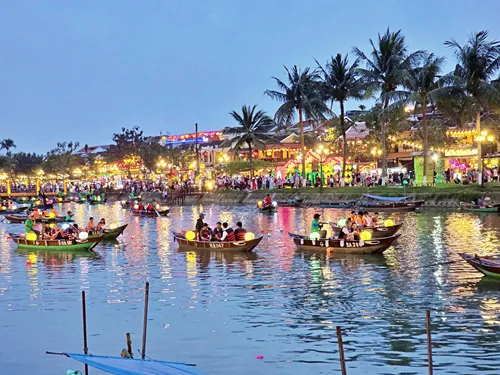 photo of red Lanterns at a yellow house in Hoi An during the Hoi An Lantern Festival in Vietnam