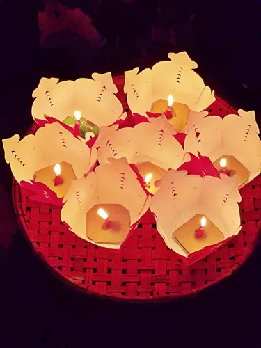 photo of seven red paper lanterns that are being sold for release on the river during the Hoi An Lantern Festival in Vietnam