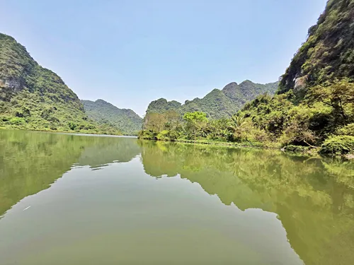 sampan ride to Hang Nau Ruou (Wine-Brewing Cave) on Route 1 of the Trang An Boat near Ninh Binh in Vietnam