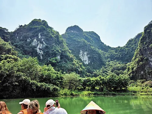 sampan ride to Hang Quý Hậu (Quý Hậu Cave) on Route 1 of the Trang An Boat near Ninh Binh in Vietnam